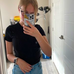 Tight black cropped t shirt.